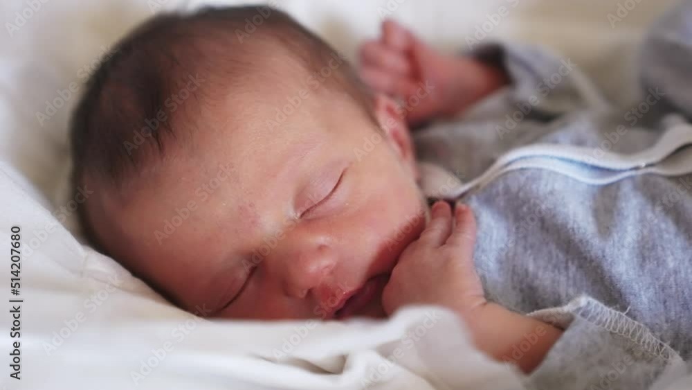 newborn baby sleeping. cute a brunette newborn baby sleeping in bed close up in maternity hospital bedroom. happy family lifestyle kid dream concept. cute newborn baby girl sleeping close up newborn baby sleeping. cute a brunette newborn baby sleeping in bed close up in maternity hospital bedroom. happy family lifestyle kid dream concept. cute newborn baby girl sleeping close up