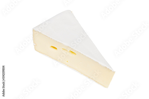 A piece of yellow brie cheese on a white background. Close-up.