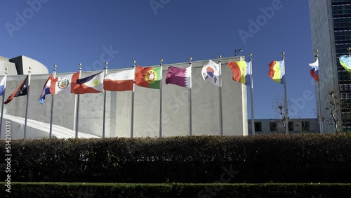 Flags flying in wind. Russian, Romanian Poland flag flying at UN headquarter in NYC