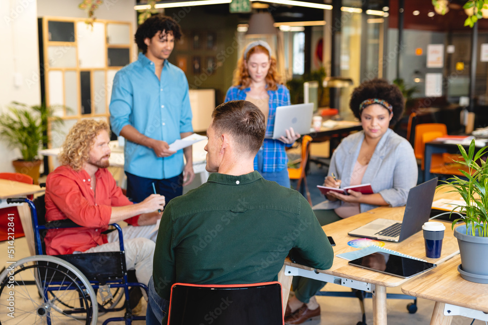 Multiracial businesswomen and businesswomen discussing business plan in meeting at office Multiracial businesswomen and businesswomen discussing business plan in meeting at office