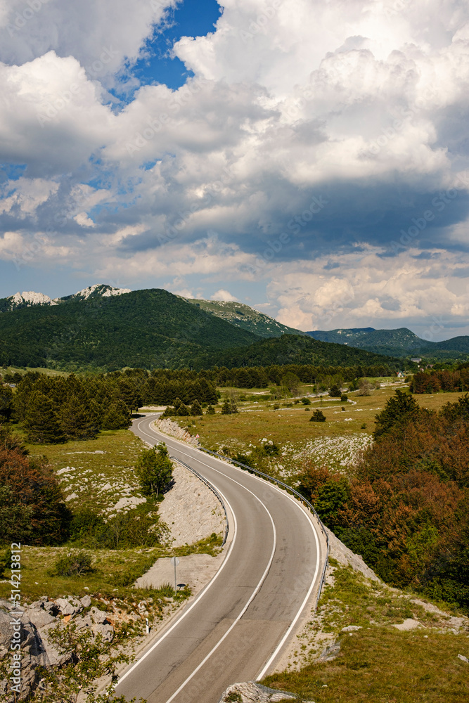 mountain road near the Adriatic coast, summer, light cakes, no people