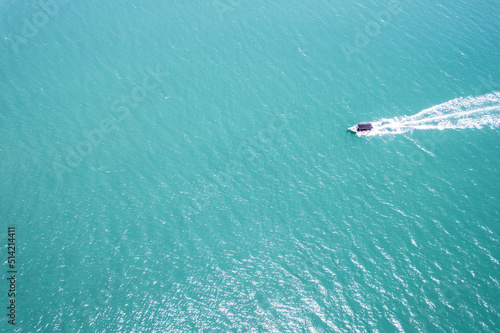 Aerial view of boat at the middle of the ocean