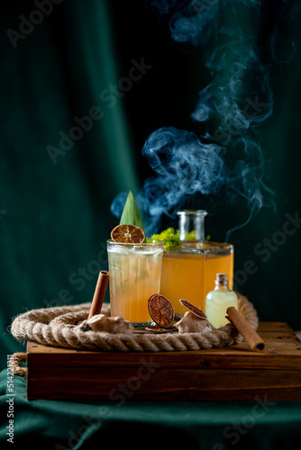 Coctail with cinnamon and citra juce. smoke
