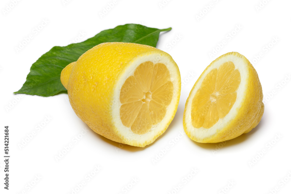 Halved Amalfi lemon close up isolated on white background