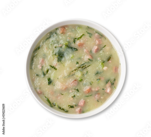 Traditional portuguese green soup with potato, green cabbage and sausage in a bowl isolated over white background
