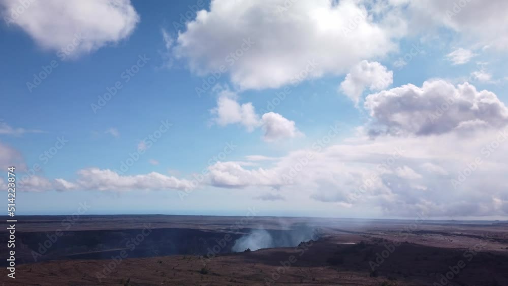 Handheld boom down shot from the sky to the smoking Kilauea volcano cauldron. 4K Handheld boom down shot from the sky to the smoking Kilauea volcano cauldron. 4K