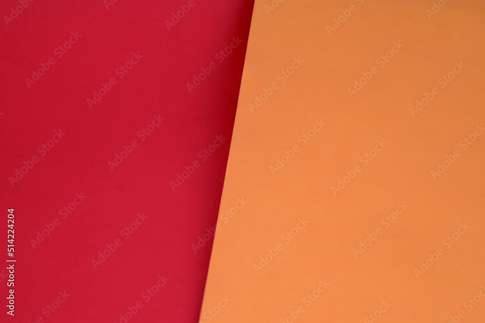 Dark vs light abstract Background with plain subtle smooth de saturated orange red colours parted into two