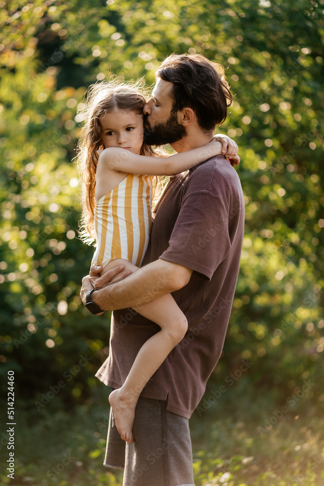 portrait of a father hugging his offended daughter portrait of a father hugging his offended daughter