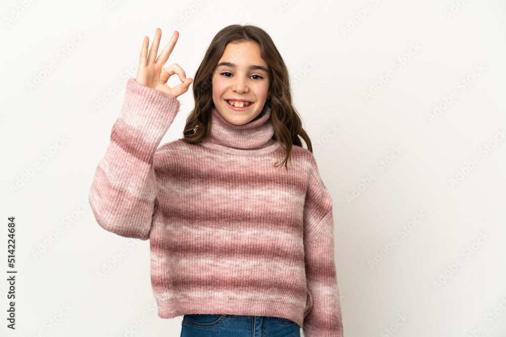 Little caucasian girl isolated on white background showing ok sign with fingers Little caucasian girl isolated on white background showing ok sign with fingers