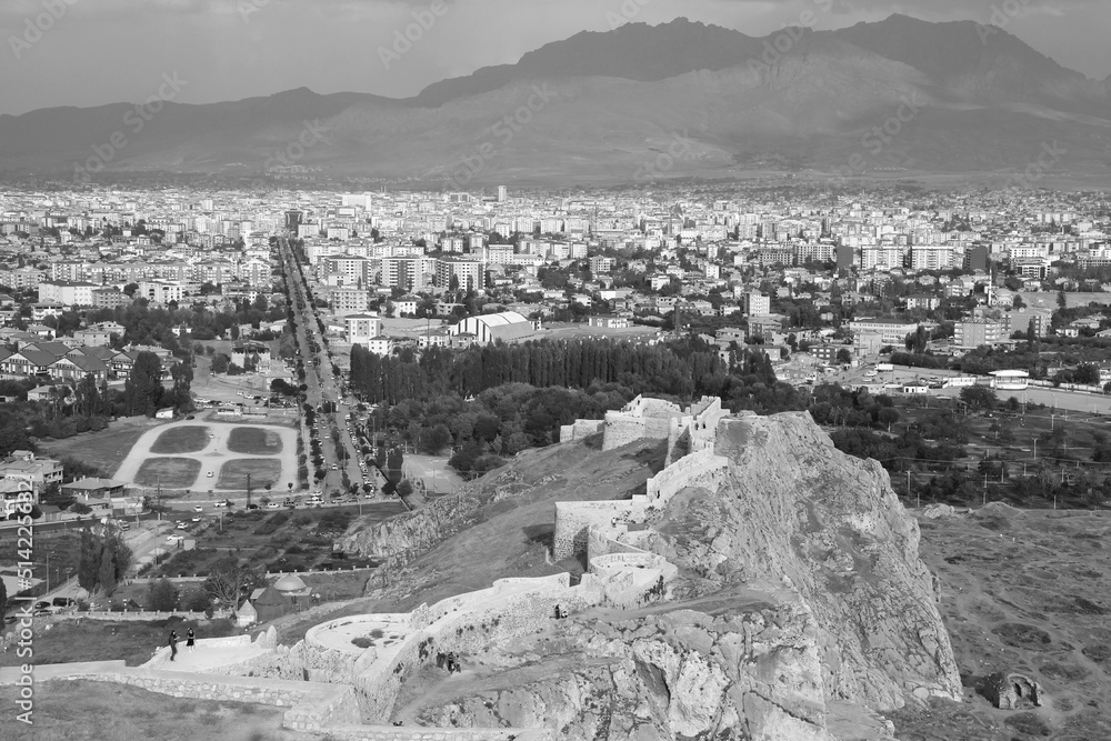 Black and white panorama of the city of Van against the background of the mountains with part of the castle of Van on a high cliff in the foreground in the Eastern Anatolia region of Turkey Black and white panorama of the city of Van against the background of the mountains with part of the castle of Van on a high cliff in the foreground in the Eastern Anatolia region of Turkey
