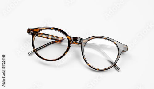 Stylish leopard-colored eyeglasses on a white background