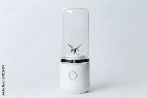 Portable small blender for making smoothie isolated on white background.