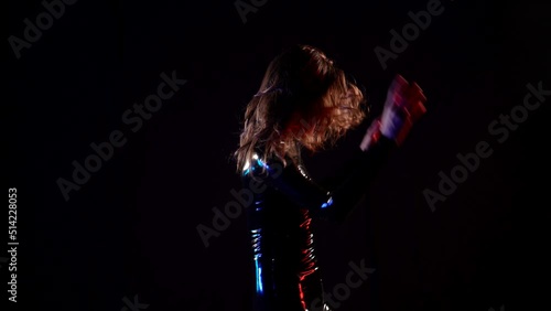 role-playing game a woman in a black latex suit from a sex shop in an intimate atmosphere