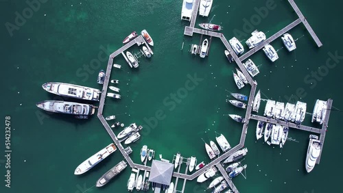 Mega yachts docked in Marigot Marina in St. Martin - top down rotating climb photo