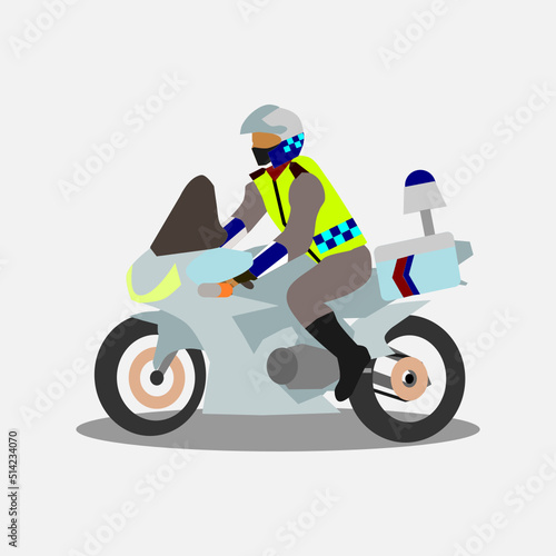 Indonesian policeman riding motorcycle in duty