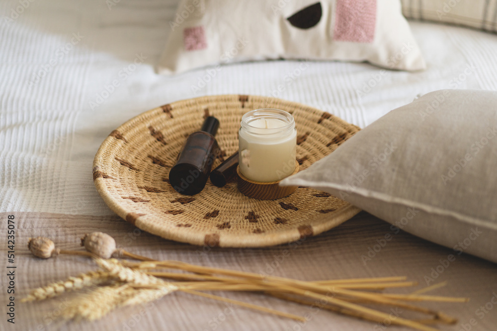 Linen pillows on a white bed with home decor. Still life details in home on a bed. Cozy home. Sweet home Linen pillows on a white bed with home decor. Still life details in home on a bed. Cozy home. Sweet home
