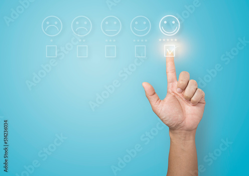 human hand customer experience concept showing five star excellent rating on blue background