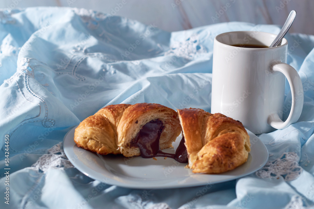 Plate of fresh croissants with chocolate stuffing Plate of fresh croissants with chocolate stuffing