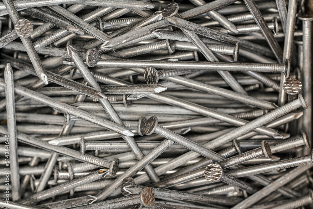 Heap of simple iron nails, closeup detail view from above Heap of simple iron nails, closeup detail view from above