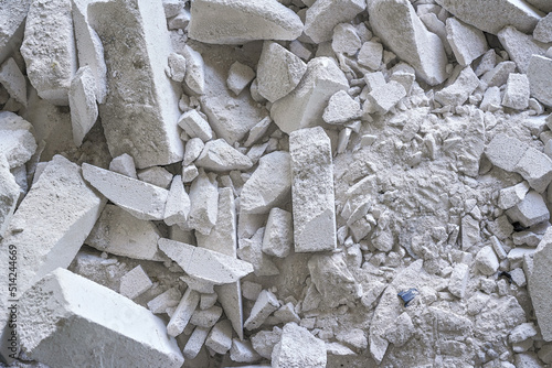 Construction waste debris - remains of white aac - autoclaved aerated concrete brick blocks, closeup detail photo