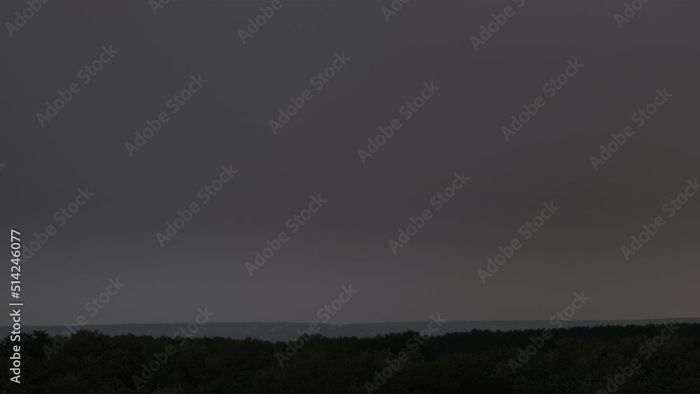 Lightning flash in storm clouds. Heavy clouds bring multiple flashes of