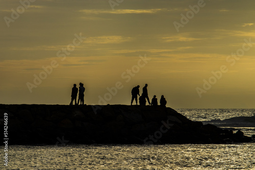 Silhouette photo of people relaxing on the beach  Aceh  Indonesia.