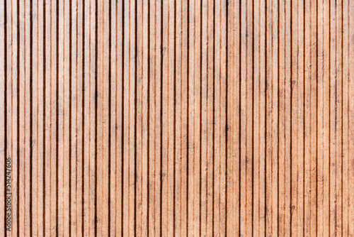 Brown corrugated metal fence background.