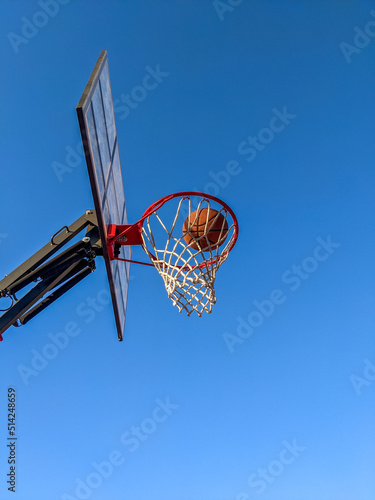 Ball in a basket on a background of clear sky © Cavan