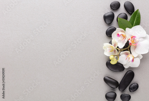 Spa stone, orchid theme objects on grey background.