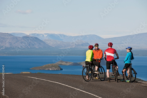 Cyclist stopping at viewpoint above Thingvallavatn lake photo