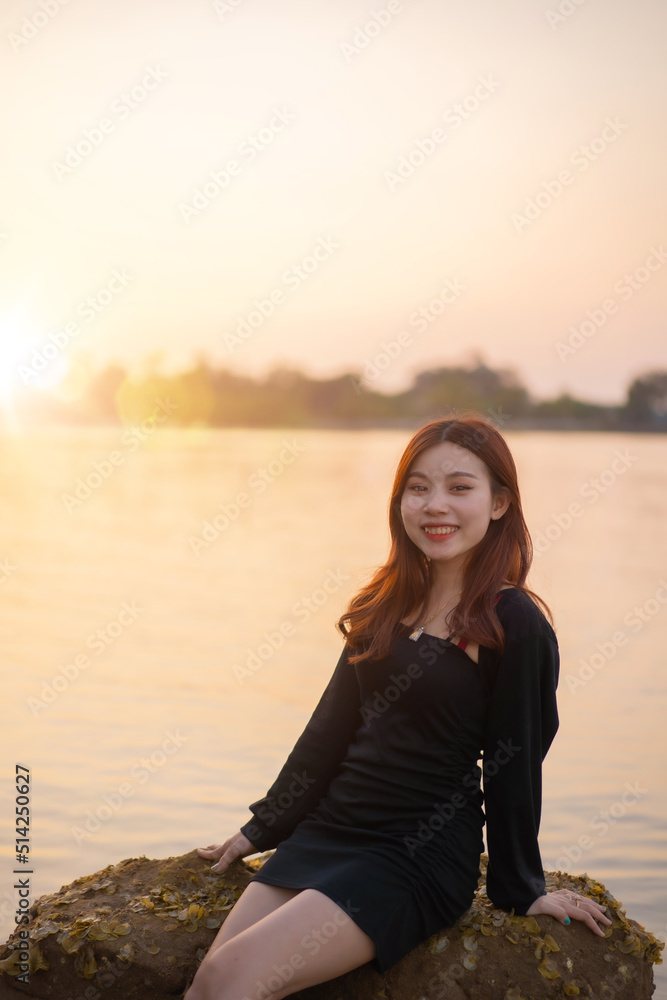 Cambodian woman at sea in the evening in Sihanoukville, Cambodia