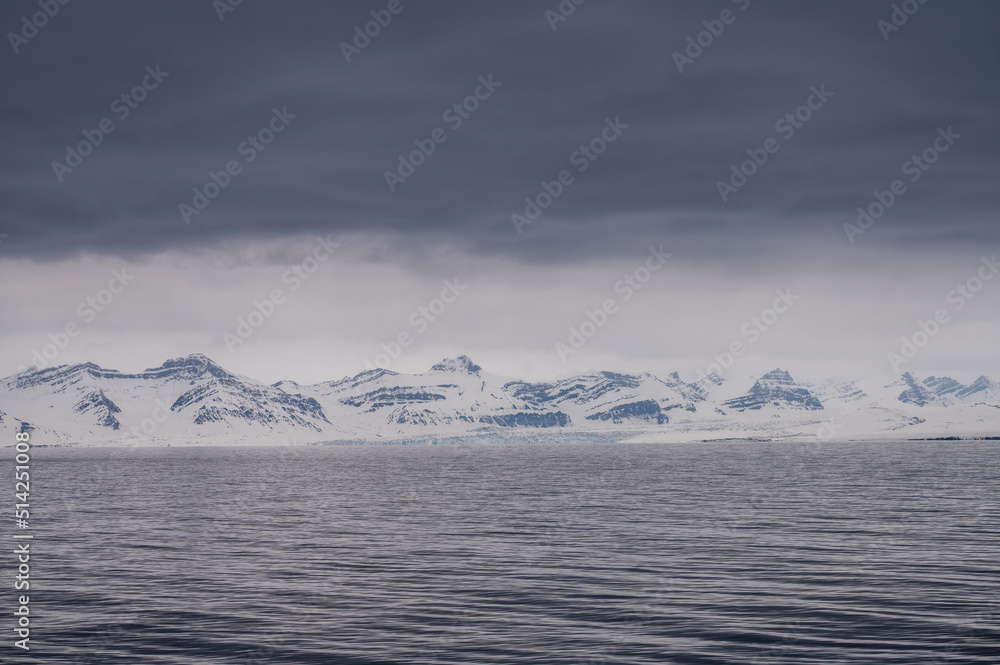 Ice covered mountains on the coast of Svalbard