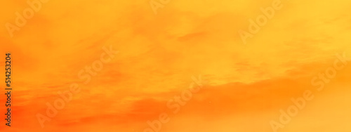 Abstract orange background with clouds, A red and orange burning overcast clouds cape sky with tiny clouds, beautiful orange background for any design and wallpaper.