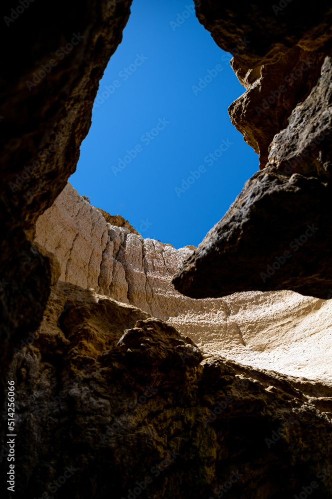 sky through hole in rocky cave