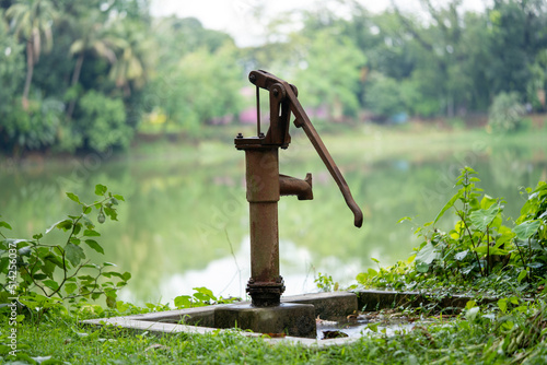 Hand-operated water pump, rusted and forgotten