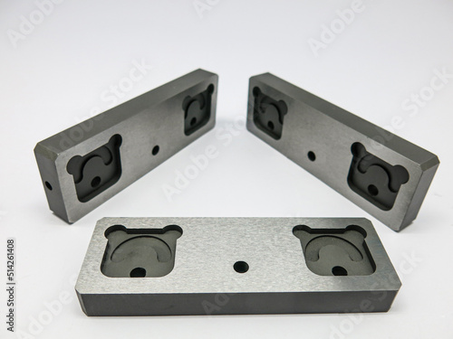 3 pieces of steel sheet, vertically placed in a triangle shape. produced by machines CNC computer program transforms into a panda like an animal but is a part of industrial machinery