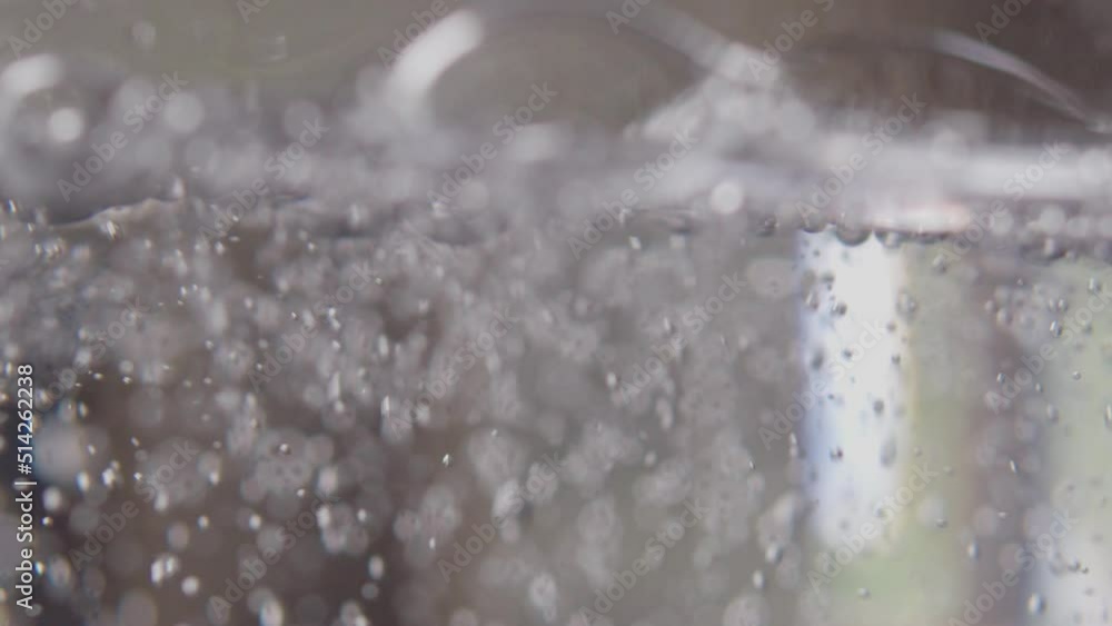 Gas bubbles going up in water. Boiling water. Gas bubbles going up in water. Boiling water.