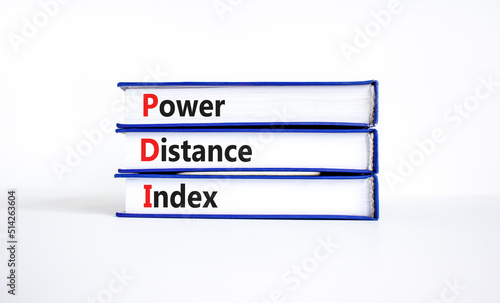 PDI power distance index symbol. Concept words PDI power distance index on books on a beautiful white background. Business PDI power distance index concept. Copy space.