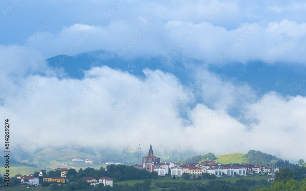 The village of Aduna and Mount Hernio among the clouds, Euskadi