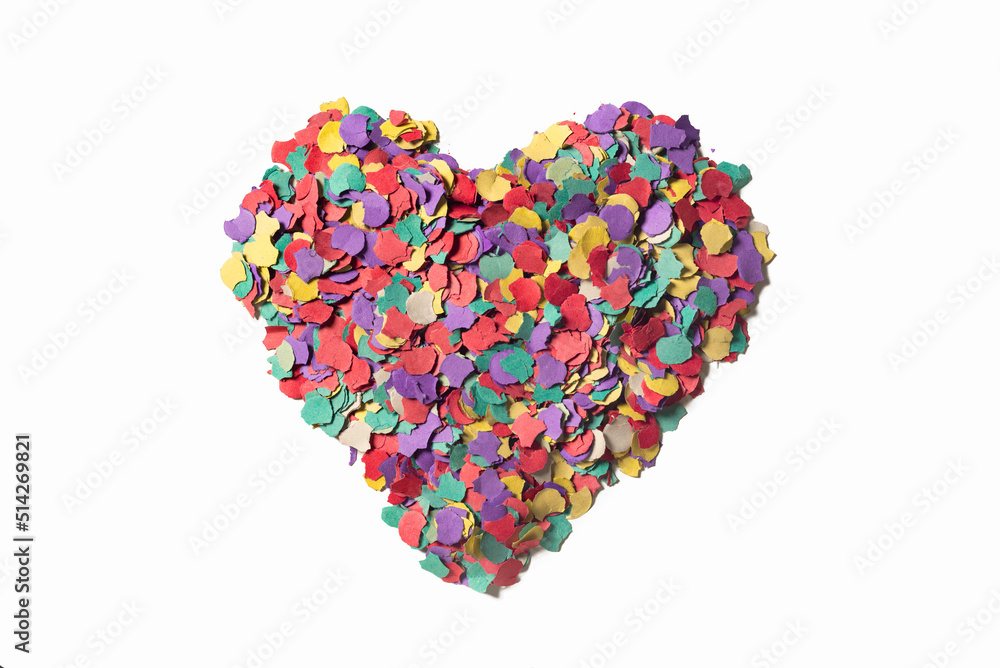 heart of colored confetti, on white background. symbolizes joy and good feeling.

