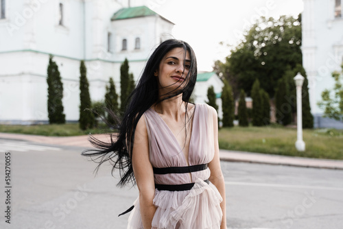 Adorable georgian woman walking in city. Attractive model in fashion dress posing on the street. Lifestyle. © Rabizo Anatolii