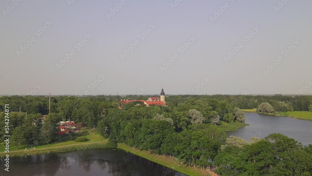Aerial view of Nesvizh Castle, Belarus. Medieval castle and palace. Restored medieval fortress. Heritage concepts. World monument of architecture. Aerial view of Nesvizh Castle, Belarus. Medieval castle and palace. Restored medieval fortress. Heritage concepts. World monument of architecture.