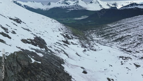 snow covered mountains in Romsdal, Norway photo