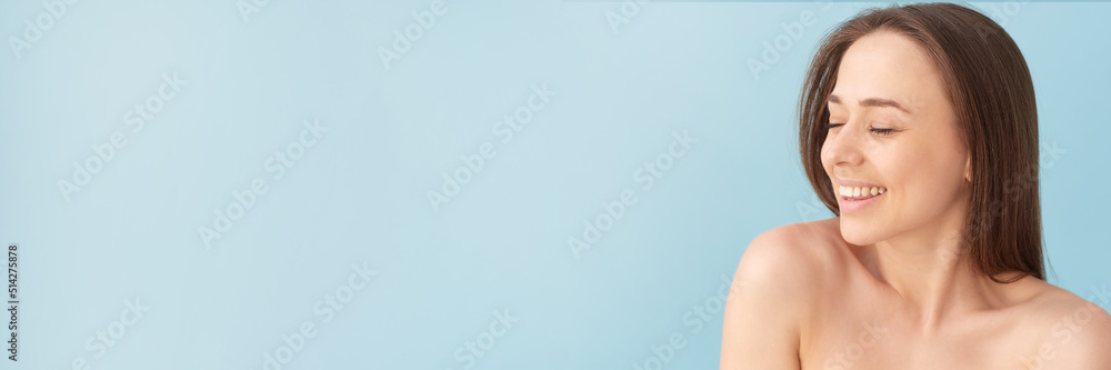 Beauty portrait of woman with clean healthy skin on blue background. Smiling dreamy beautiful woman. Web banner. Beauty portrait of woman with clean healthy skin on blue background. Smiling dreamy beautiful woman. Web banner.