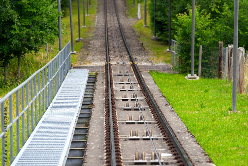 Fototapeta premium Railway track of Gurten cable car with cable wheels on a sunny sumner day Photo taken June 16th, 2022, Gurten, Switzerland.