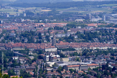 Fototapeta Naklejka Na Ścianę i Meble -  Aerial view over City of Bern and Canton Bern seen from local mountain Gurten on a blue cloudy summer day. Photo taken June 16th, 2022, Gurten, Switzerland.