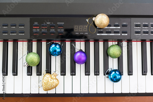 New Year's composition on a musical synthesizer. lights of a garland. Merry Christmas greeting card. Happy New Year