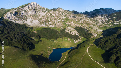 Orlovacko Lake in Zelengora mountains in Sutjeska National Park. Lake surrounded by mountains. Hiking life. Travel and adventurous. Camping by the lake. Scenic and beautiful view. 
 photo