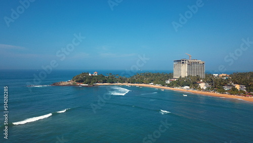 Beach coastline in Unawatuna, Sri Lanka. Popular destination for tourists visiting Sri Lanka. Situated close to Galle and Mirissa