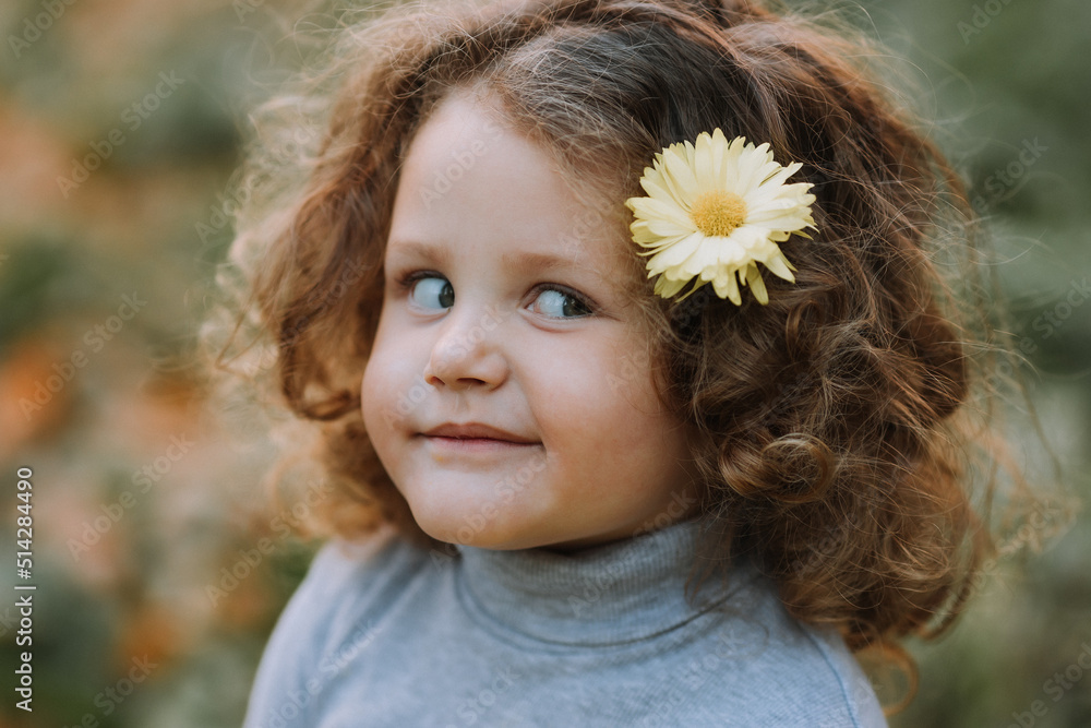 portrait of cute little girl in blue shirt with flower in hair, fall, autumn, card, banner portrait of cute little girl in blue shirt with flower in hair, fall, autumn, card, banner